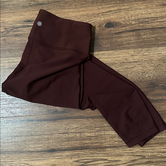 Athleta Interval High Rise Perforated Legging. Size medium. Color is Garnet - Picture 5 of 10